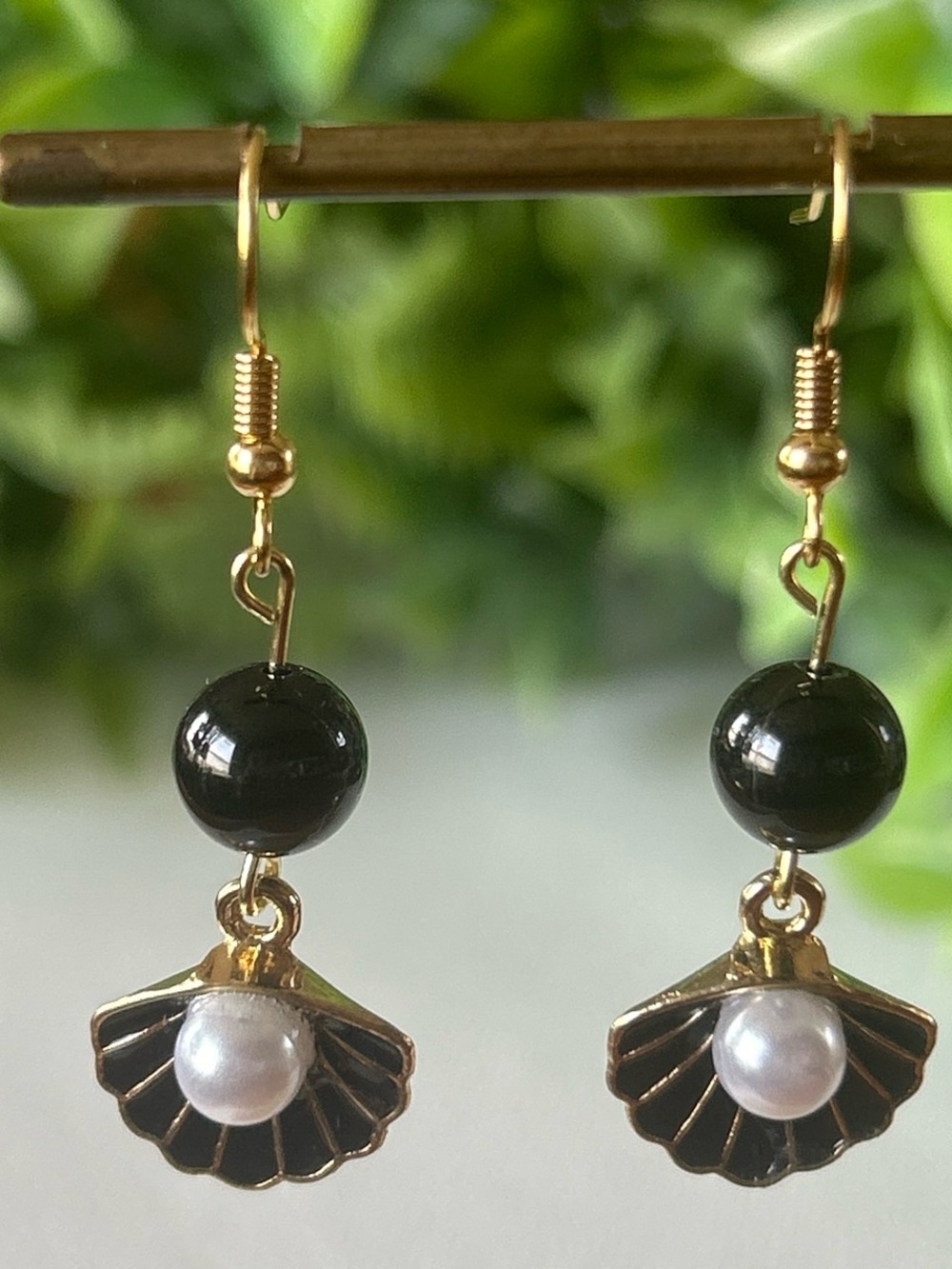 Handmade black tourmaline shell earrings with faux pearl detail